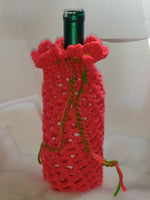 Christmas colored crocheted wine cozies